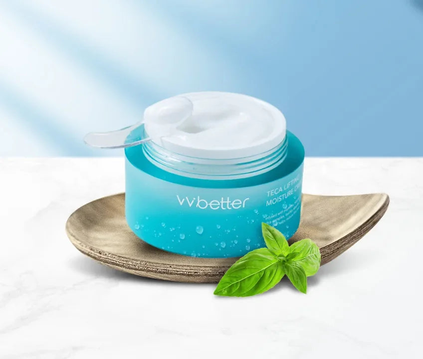 Teca Lifting Moisture Cream jar with its lid resting on a wooden tray beside a green leaf