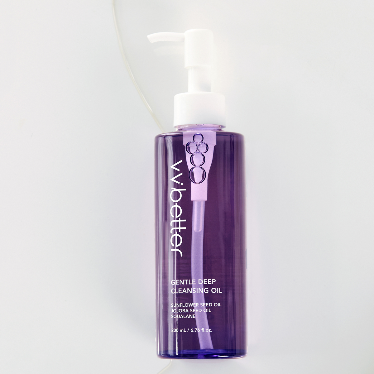Gentle Deep Cleansing Oil — bottle standing with a ribbon of oil behind it, front view