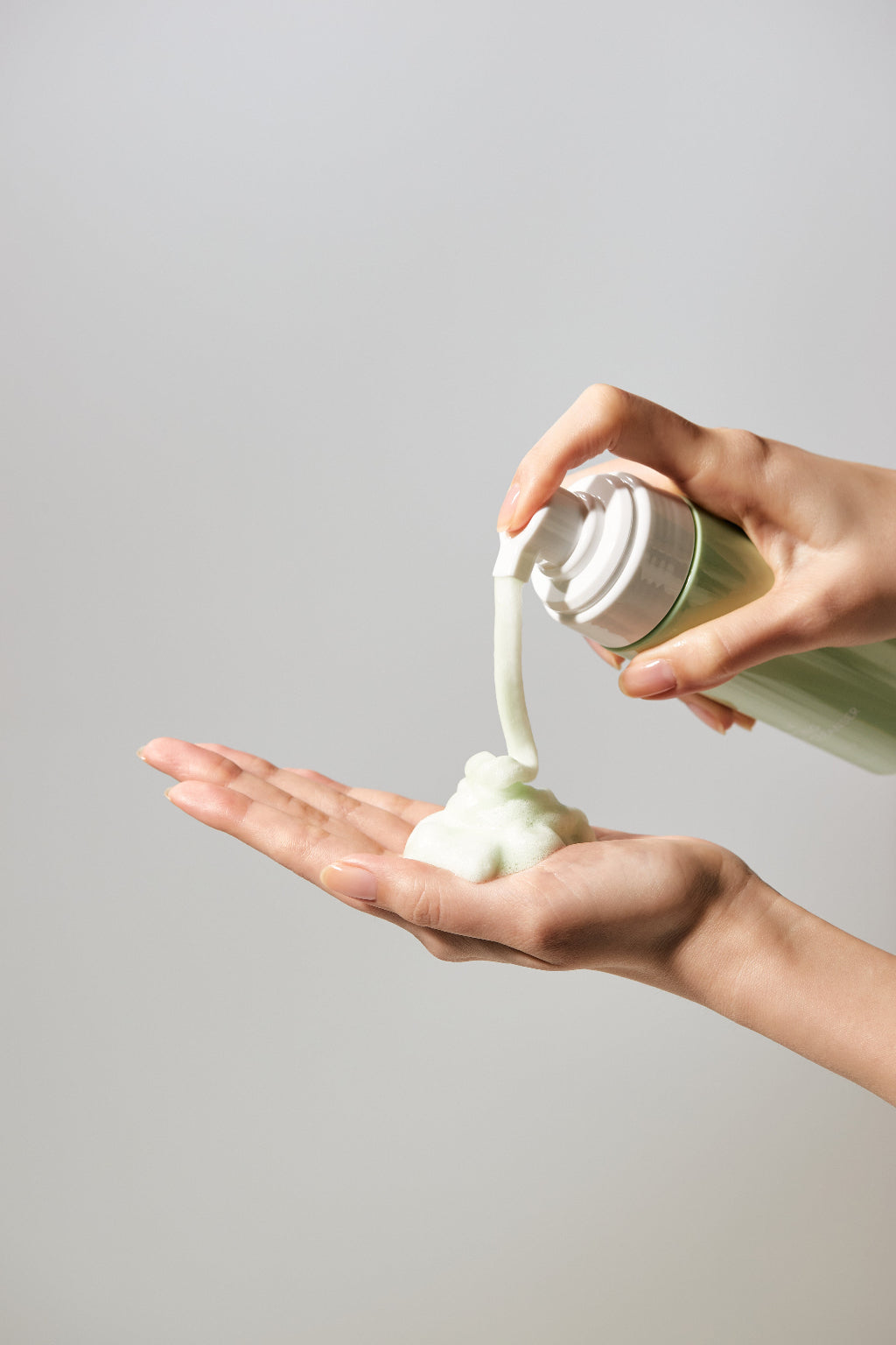 Jeju Yuja Balancing Bubble Cleanser — dense white foam pumped into a palm