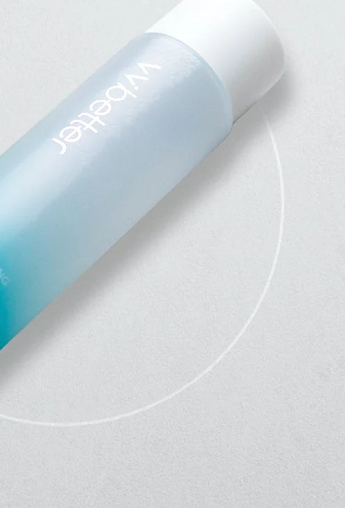 AHA Boosting Toner bottle lying diagonally on a soft grey background