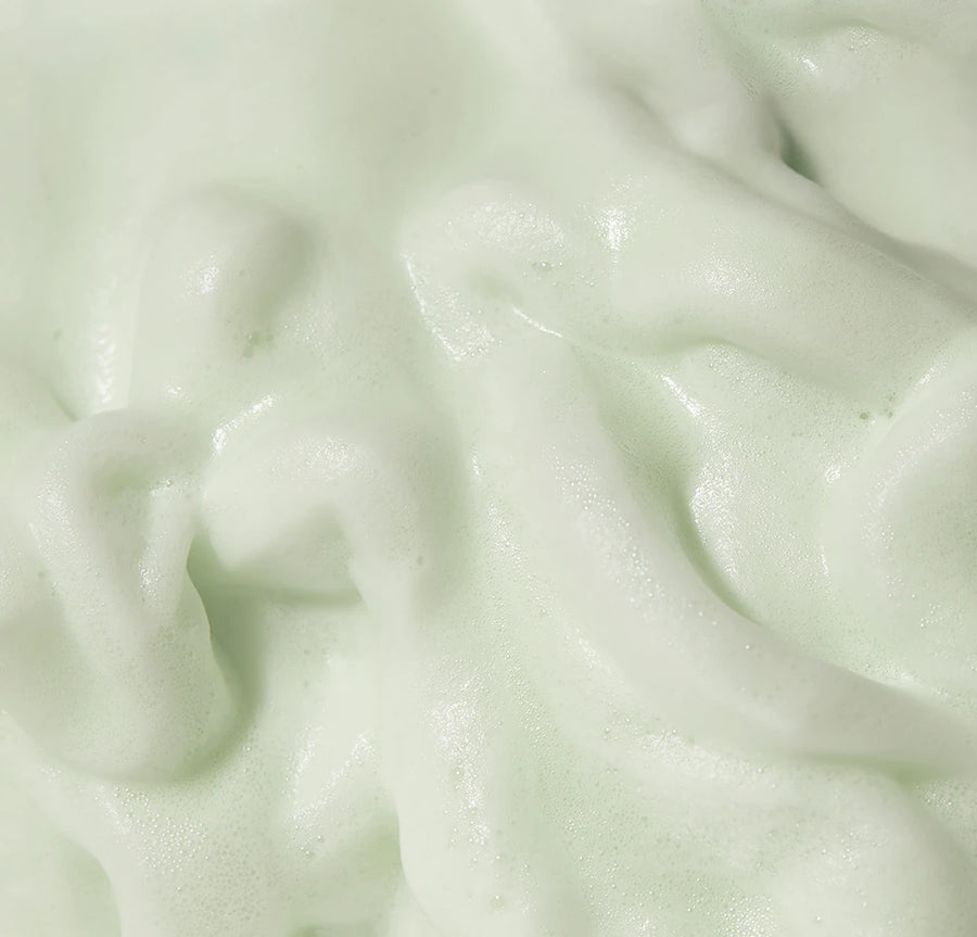 Macro of thick pale-green bubble cleanser microfoam