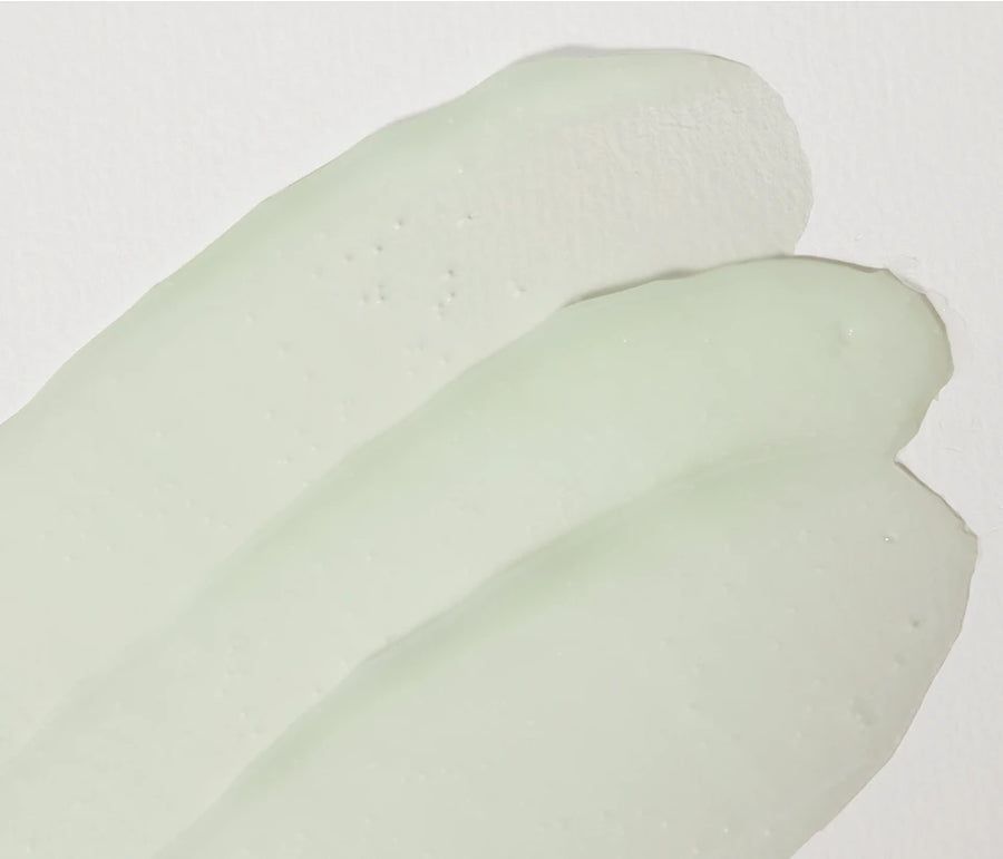Three swipes of the pale-green gel cream
