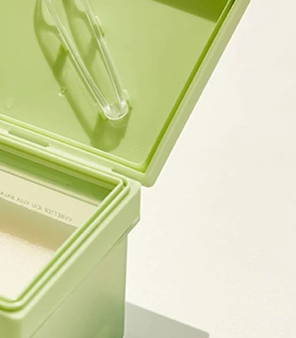 Open Jeju Yuja Balancing Pad jar with the tweezers in the lid