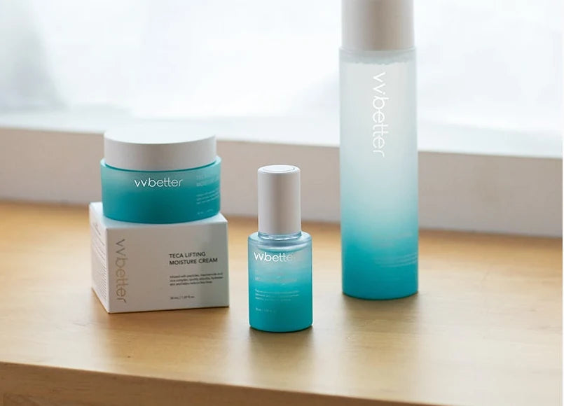 TECA cream with its carton, the serum and the toner on a wooden window sill