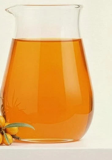 Sea buckthorn water in a glass pitcher