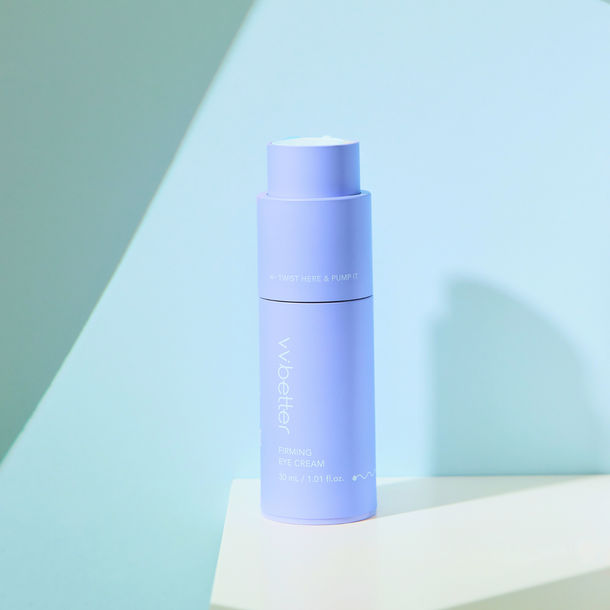 Firming Eye Cream — bottle twisted open on a white pedestal, mint backdrop
