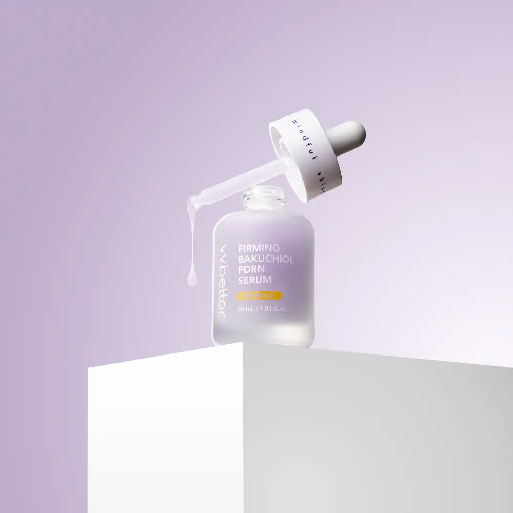 Firming Bakuchiol PDRN Serum — bottle on a white pedestal with the dropper lifted, soft purple backdrop