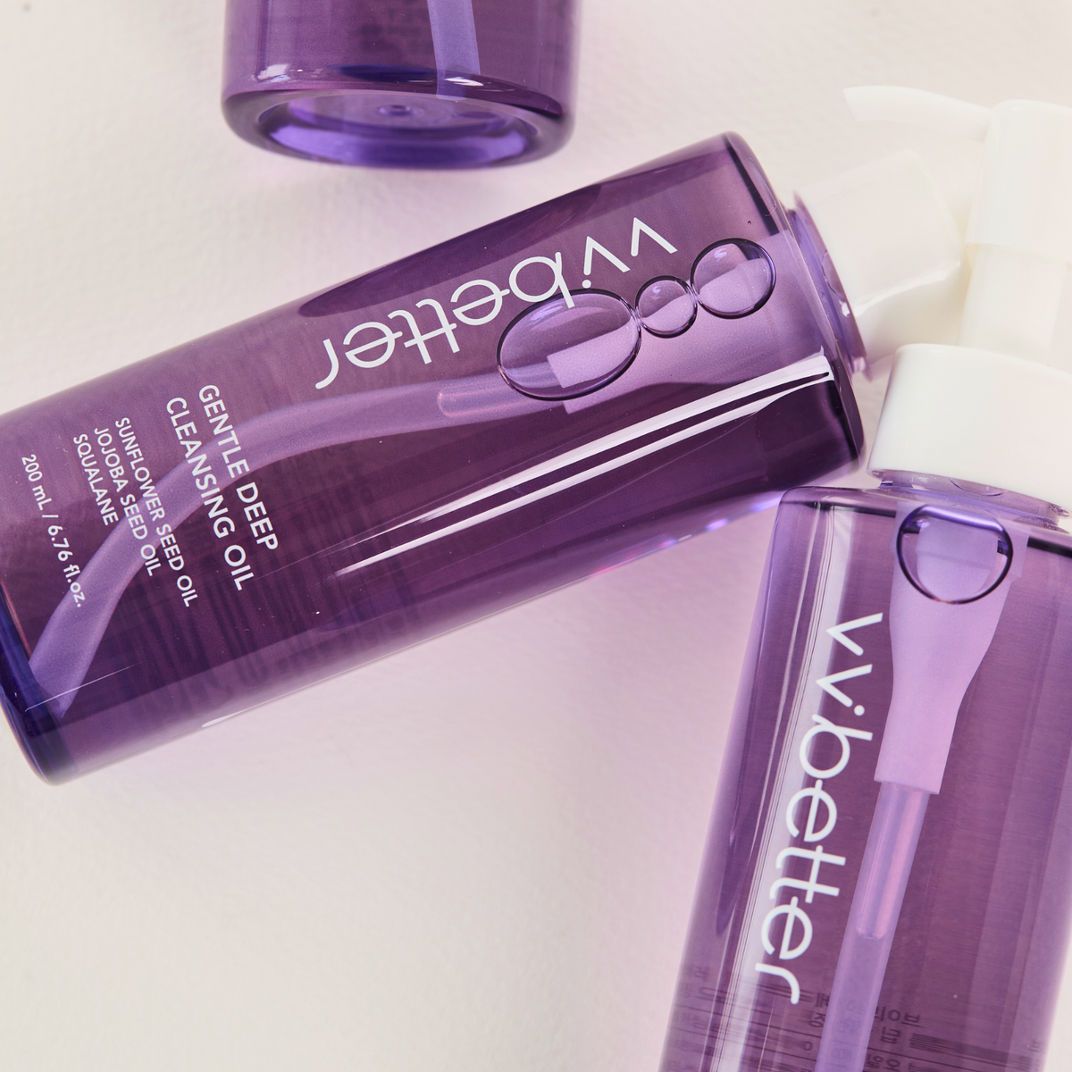 Gentle Deep Cleansing Oil — two bottles lying side by side, label close-up