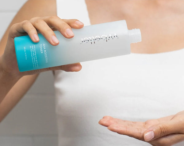 Woman pouring the toner into her palm