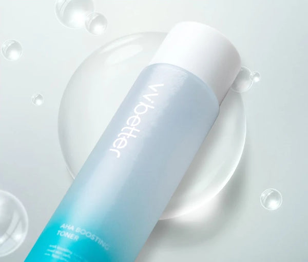 AHA Boosting Toner bottle lying among large water bubbles