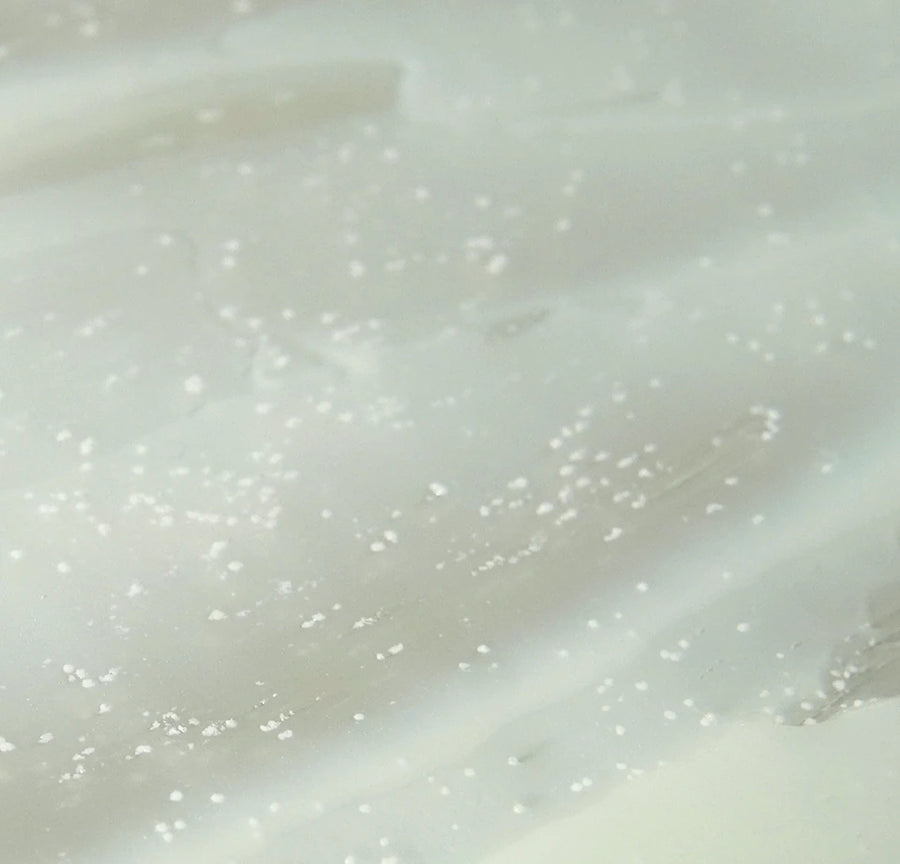 Macro of the gel cream with white ceramide capsules suspended in it