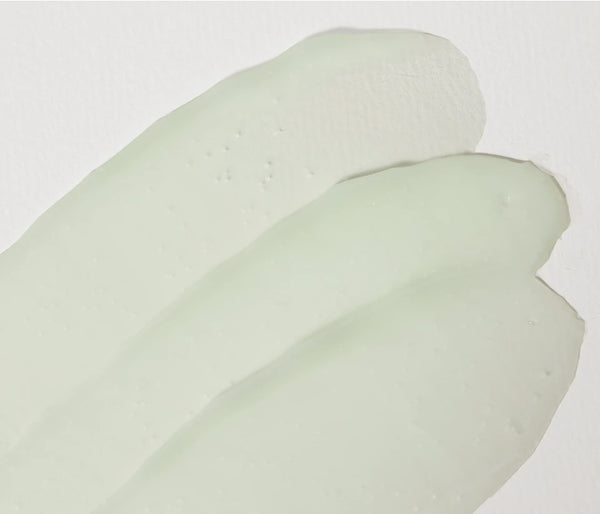 Swipes of the pale-green gel cream