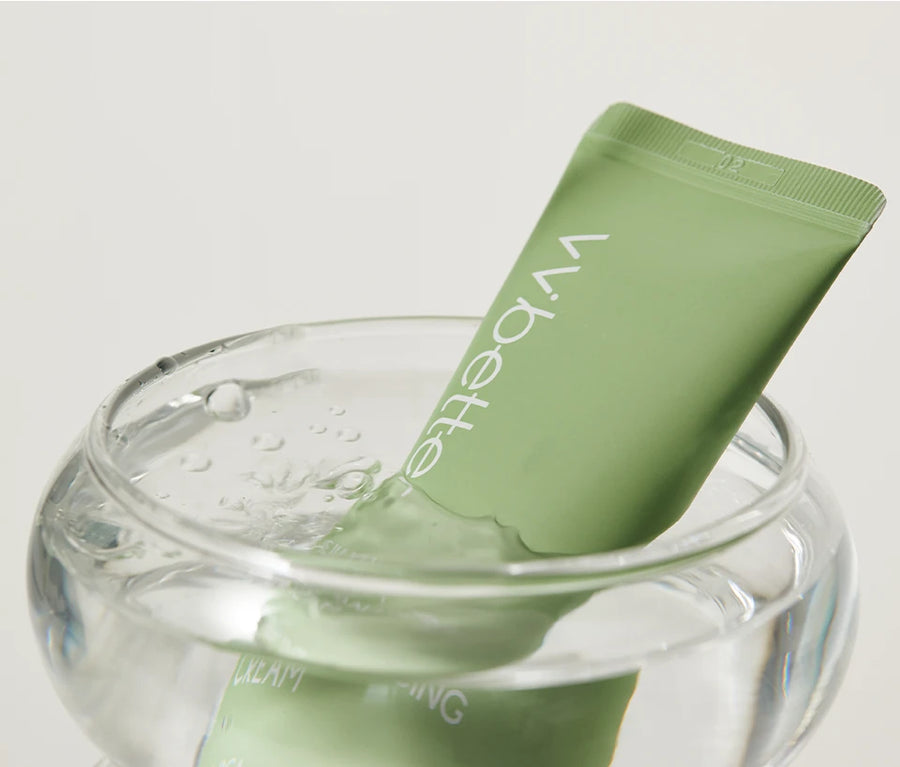 Cera Balancing Cream tube dipped into a glass bowl of clear water