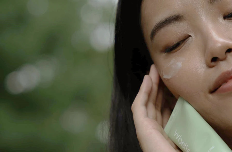 Woman patting the gel cream onto her cheek