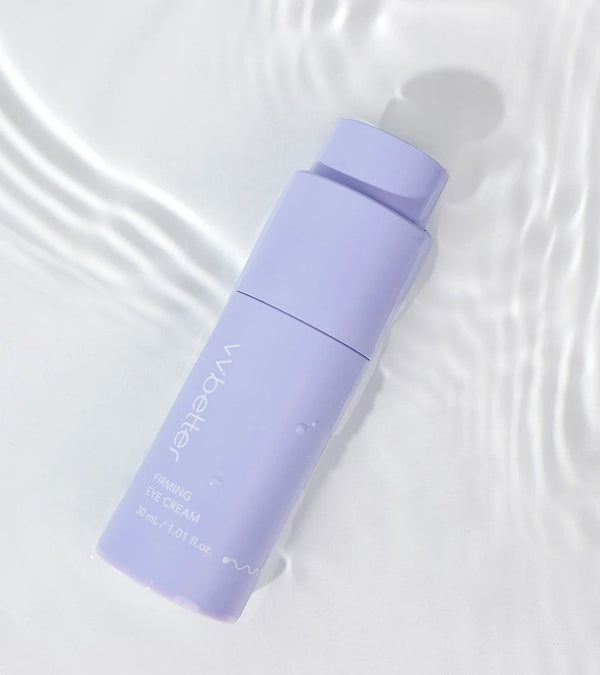 Firming Eye Cream bottle lying in shallow rippled water