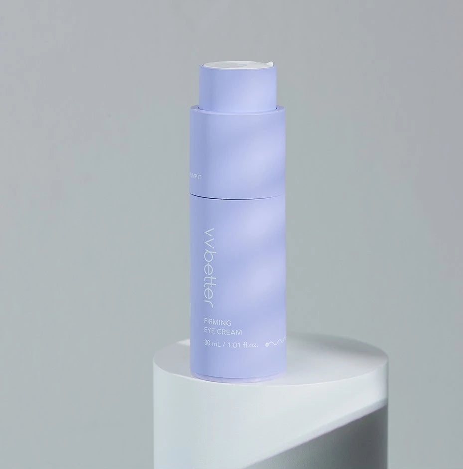 VVBETTER Firming Eye Cream twist-pump bottle on a white pedestal against a grey wall