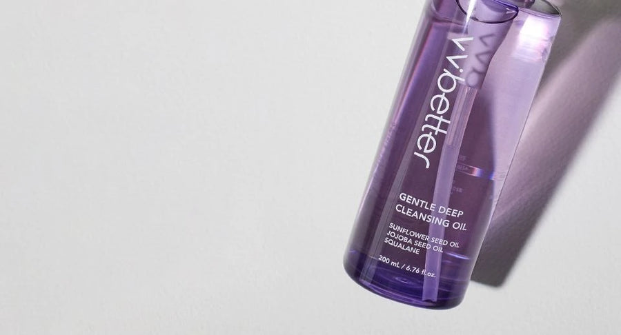 Gentle Deep Cleansing Oil bottle lying diagonally with a purple shadow