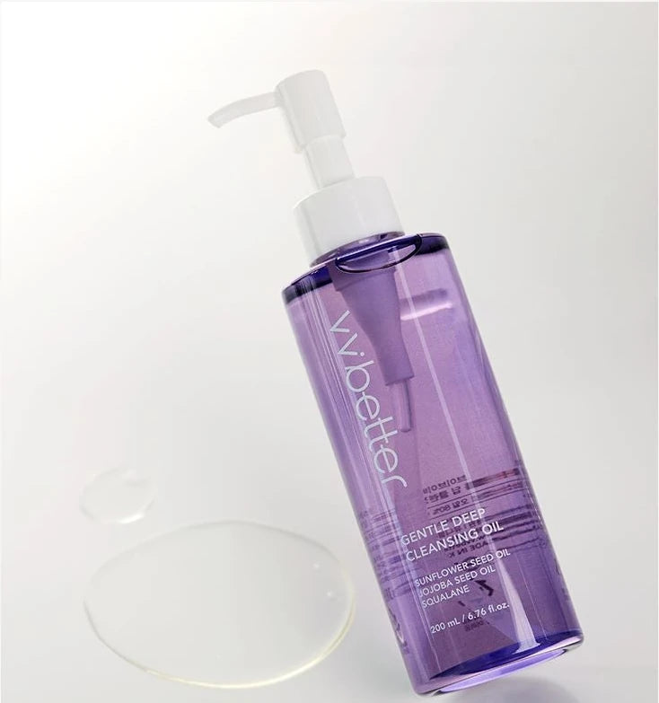 Gentle Deep Cleansing Oil bottle tilted beside a puddle of oil