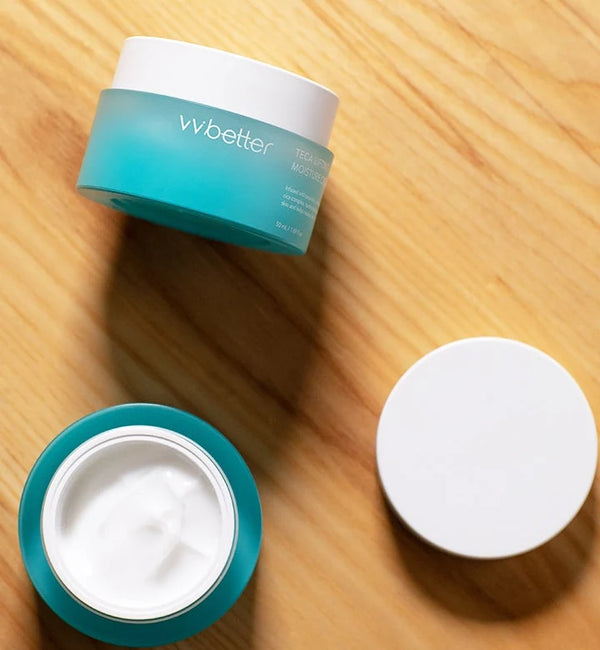 Open TECA Lifting Moisture Cream jar and lid on a sunlit wooden table