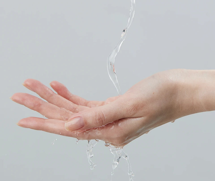 Water poured into a cupped hand