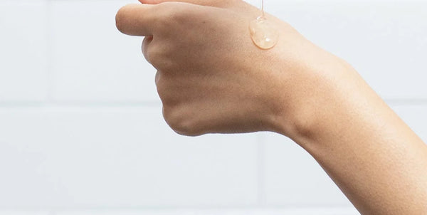 A drop of serum on the back of a hand