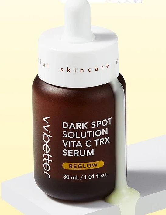VVBETTER Dark Spot Solution Vita C TRX Serum bottle with a drip of serum on a white pedestal