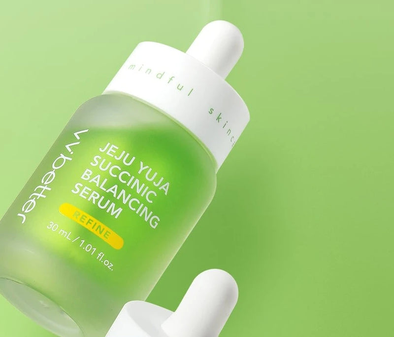 VVBETTER Jeju Yuja Succinic Balancing Serum bottle with its dropper on a green background