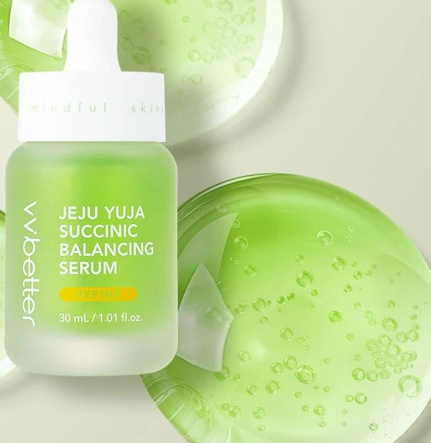 Jeju Yuja Succinic Balancing Serum bottle on large green serum droplets
